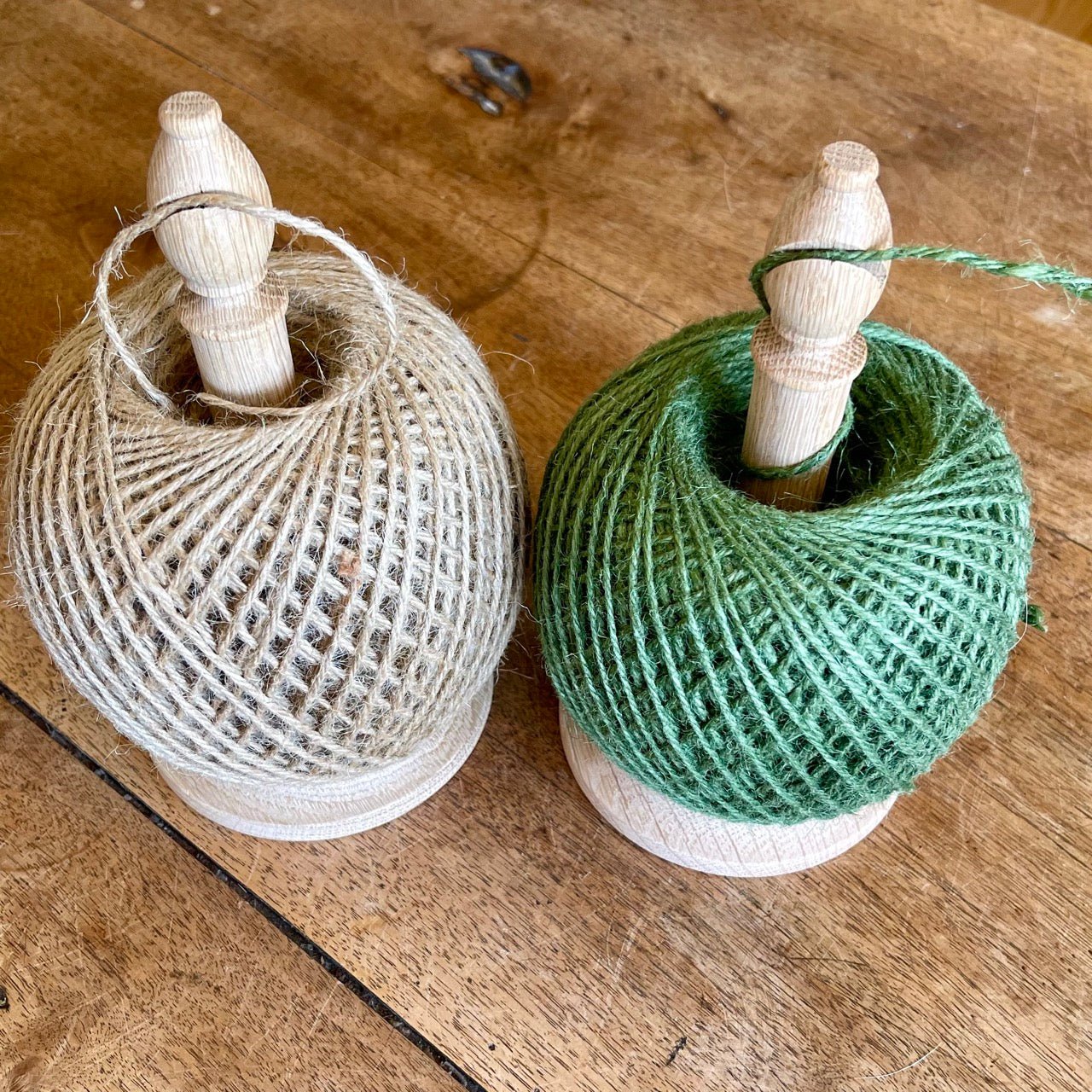 Natural oak bishop twine tidy with cutter and baker's twine from The Celtic Farm, made in Britain, shown with twine ready for use.