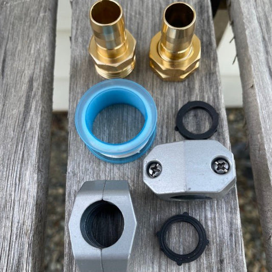 The Celtic Farm brass connectors for garden water hose repair kit showing close-up of durable metal hose fittings.