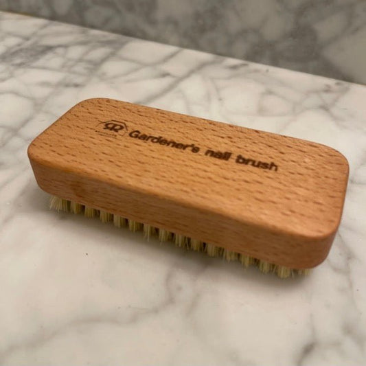 The Celtic Farm Gardener's Nail Brush with stiff bristles for cleaning dirt from nails after gardening tasks.