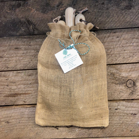 The Celtic Farm garden gift box with burlap bag containing planting efficiency tool set, bulbs, and seeds for gardening.