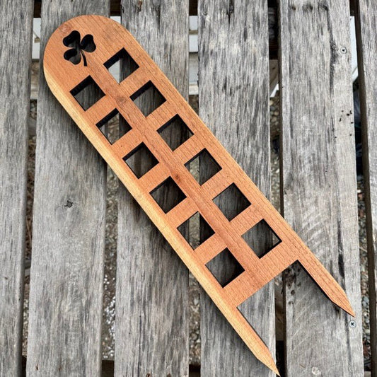 Unique Shamrock Trellis by The Celtic Farm, made in USA with cedar and redwood, featuring a decorative shamrock design.