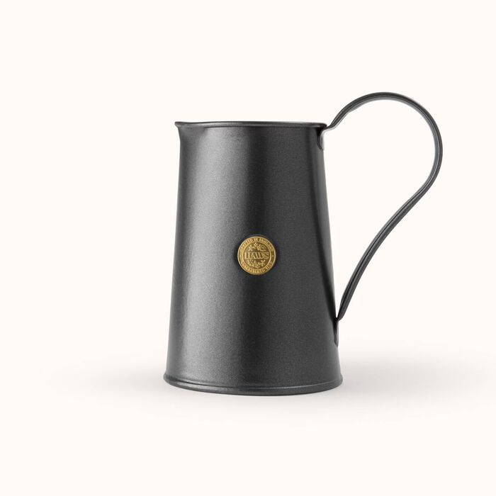 Cream-colored Haws Watering Pitcher from The Celtic Farm, a durable watering can for garden watering and plant care.