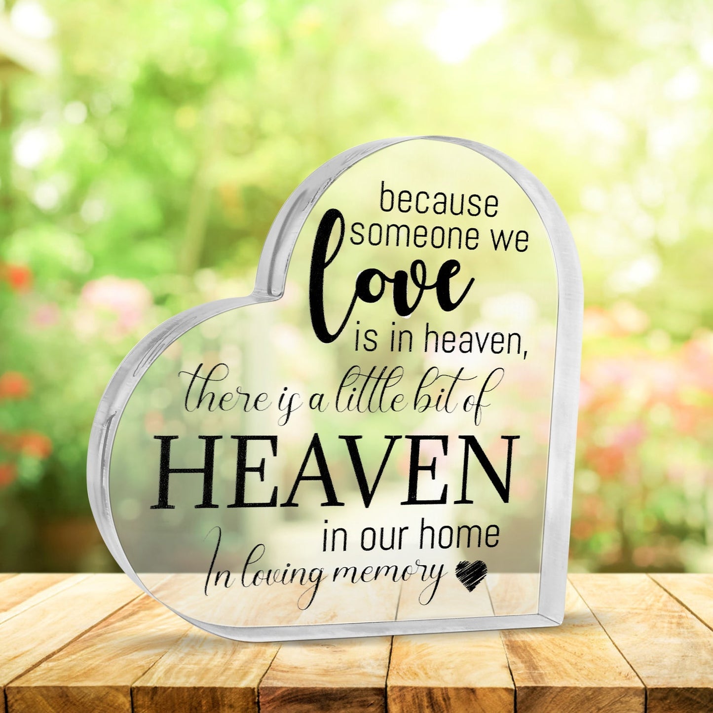 Acrylic memorial heart ornament with "Heaven In Our Home" engraving by The Wind Chime Co, featuring a clear heart shape.