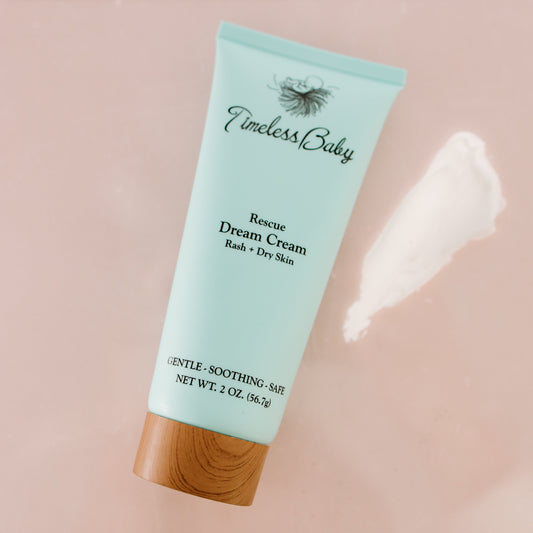 Cream jar labeled Dream Cream by Timeless Organics Skin Care, featuring a smooth, creamy texture in a natural skincare container.
