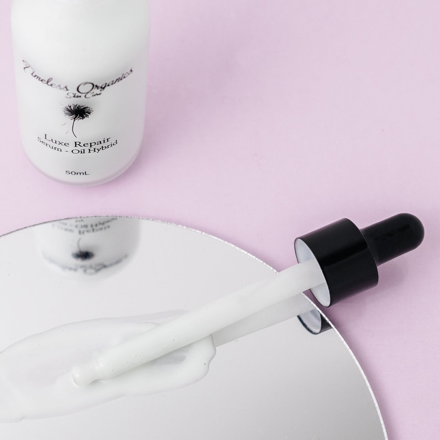 Timeless Organics Skin Care Luxe Repair Serum-Oil Hybrid in a sleek bottle, designed to nourish and repair skin.