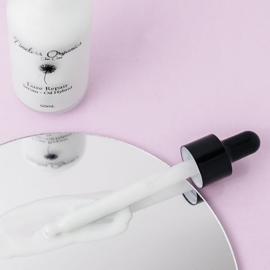 Timeless Organics Skin Care Luxe Repair Serum-Oil Hybrid in a sleek bottle, designed to nourish and repair skin.
