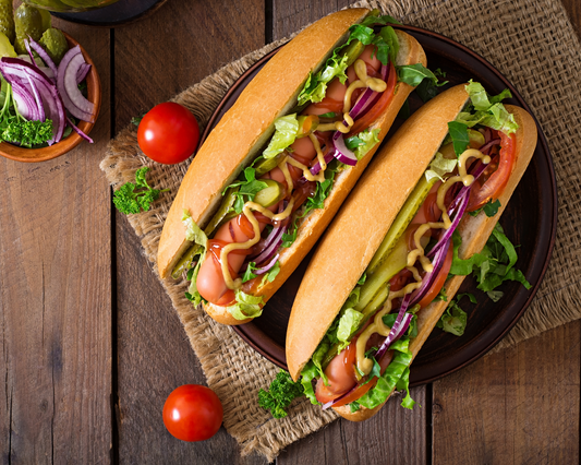 Two bags of Unbelievabuns high-protein, low-carb hot dog buns, featuring 12 buns in total, displayed in the image.