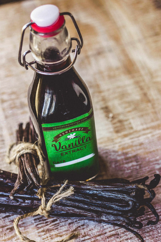 Vanilla Bean Kings homemade vanilla extract kit with organic Madagascar vanilla beans and glass jar for flavor infusion.