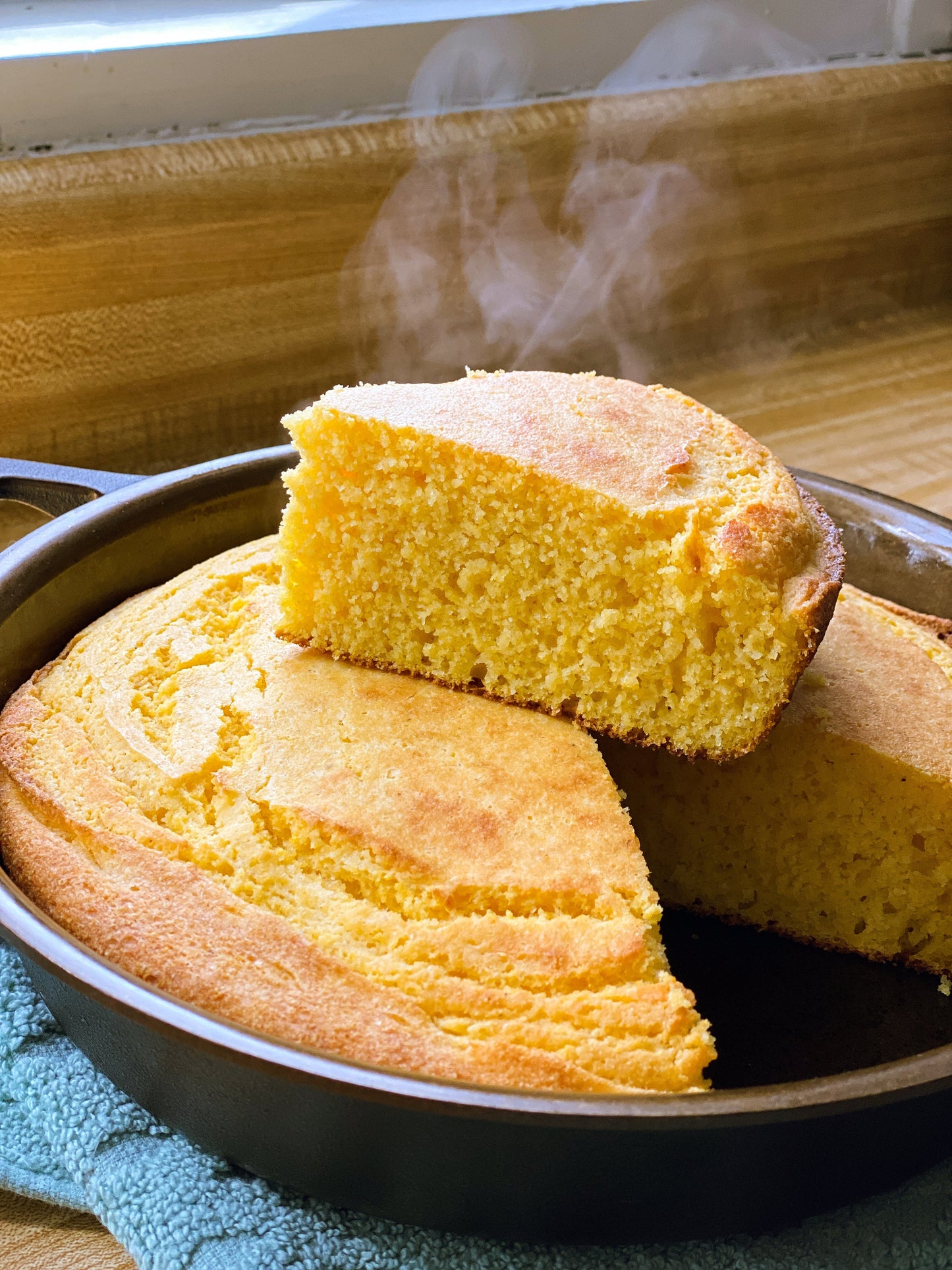 Box of WE Made buttermilk cornbread mix showing the packaging and product label.