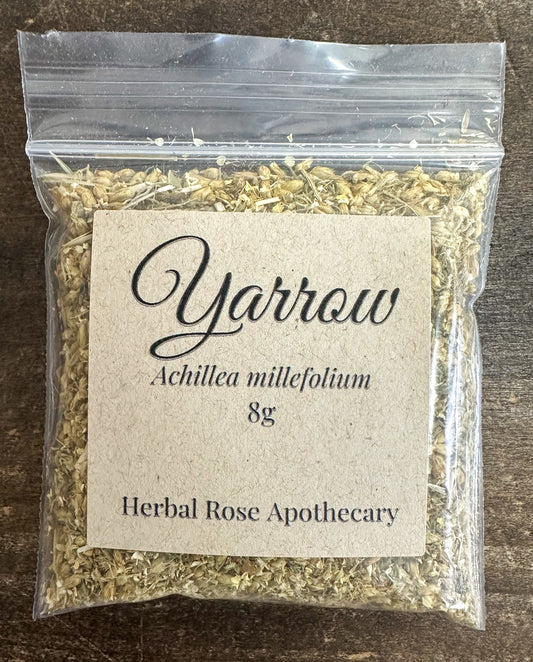 Dried Yarrow herb in an 8g package from Herbal Rose Apothecary, showcasing fresh green leaves and delicate flowers.