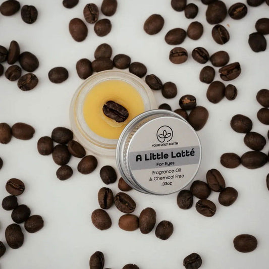 Your Only Earth A Little Latté eye balm jar with natural skin care ingredients for soothing under-eye skin.