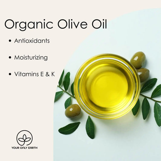 A glass bowl with yellow olive oil is surrounded by green olives, leaves, and lemongrass. The left text states: Lemongrass Soap - Organic Olive Oil, Antioxidants, Moisturizing, Vitamins E & K. At the bottom is the Your Only Earth logo.