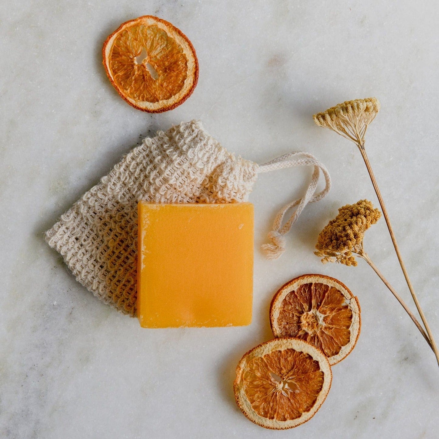 Bundle of ZeroWasteStore.com Sunshine Soap Bars, natural bar soap with bright citrus scent, packaged together on a clean surface.