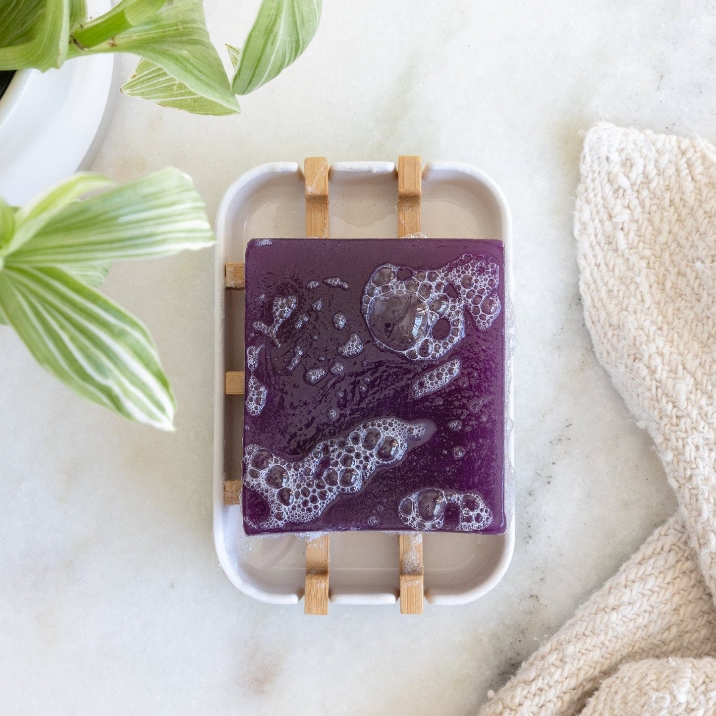 Zero Waste Glycerin Soap Bar by Suds & Eco, 4.5oz, with a bright yellow soap bar and eco-friendly packaging.