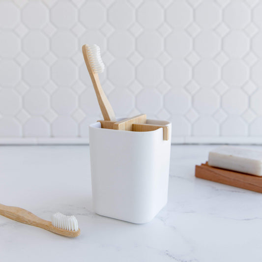 White bamboo fiber and corn starch bathroom brush holder from ZeroWasteStore.com, eco-friendly and sleek design.
