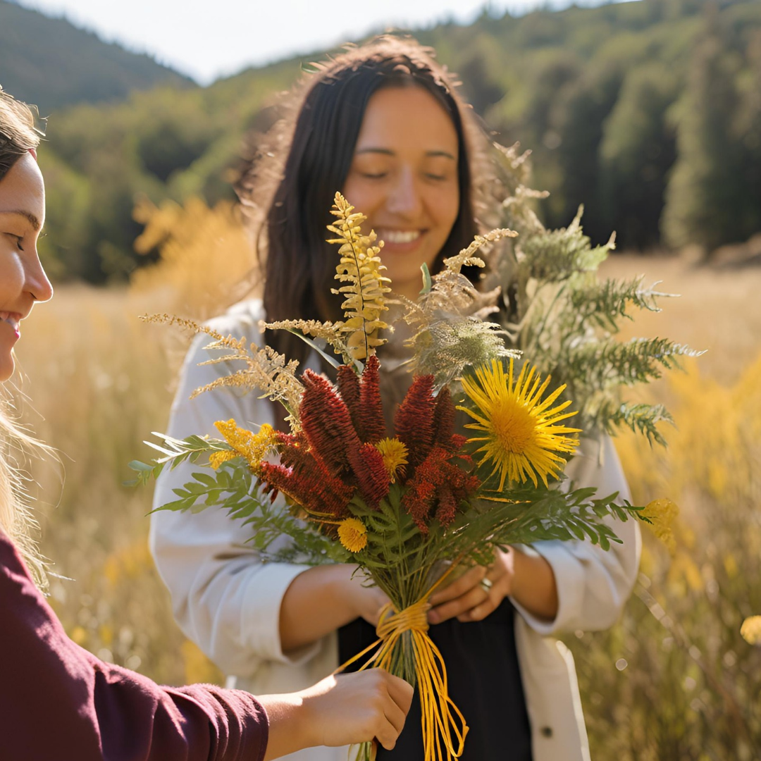 Woman with bouquet of fall wildflowers