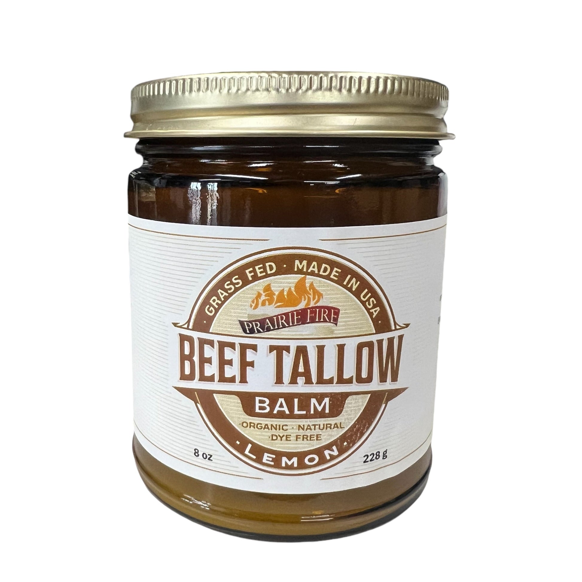A brown glass jar with gold lid, labeled Prairie Fire Tallow, Candles, and Lavender: Beef Tallow Balm - 8 oz. Made in USA from organic, grass-fed tallow. Dye-free, natural moisturizer for skin care. Contains 228g (8 oz).