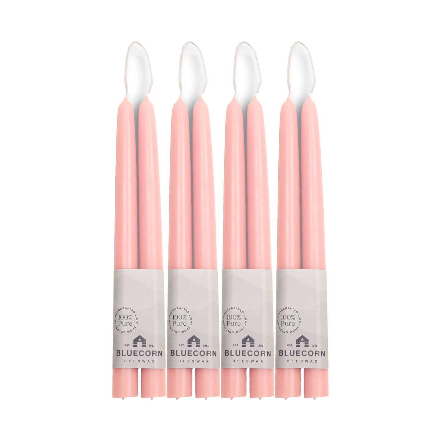 Set of eight 10-inch pink beeswax taper candles from Bluecorn Candles, hand-dipped and arranged in a bulk bundle.