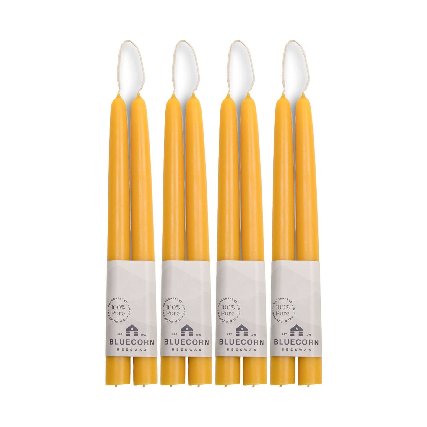 Set of eight 10-inch raw beeswax taper candles from Bluecorn Candles, perfect for rustic or vintage-style candle decor.