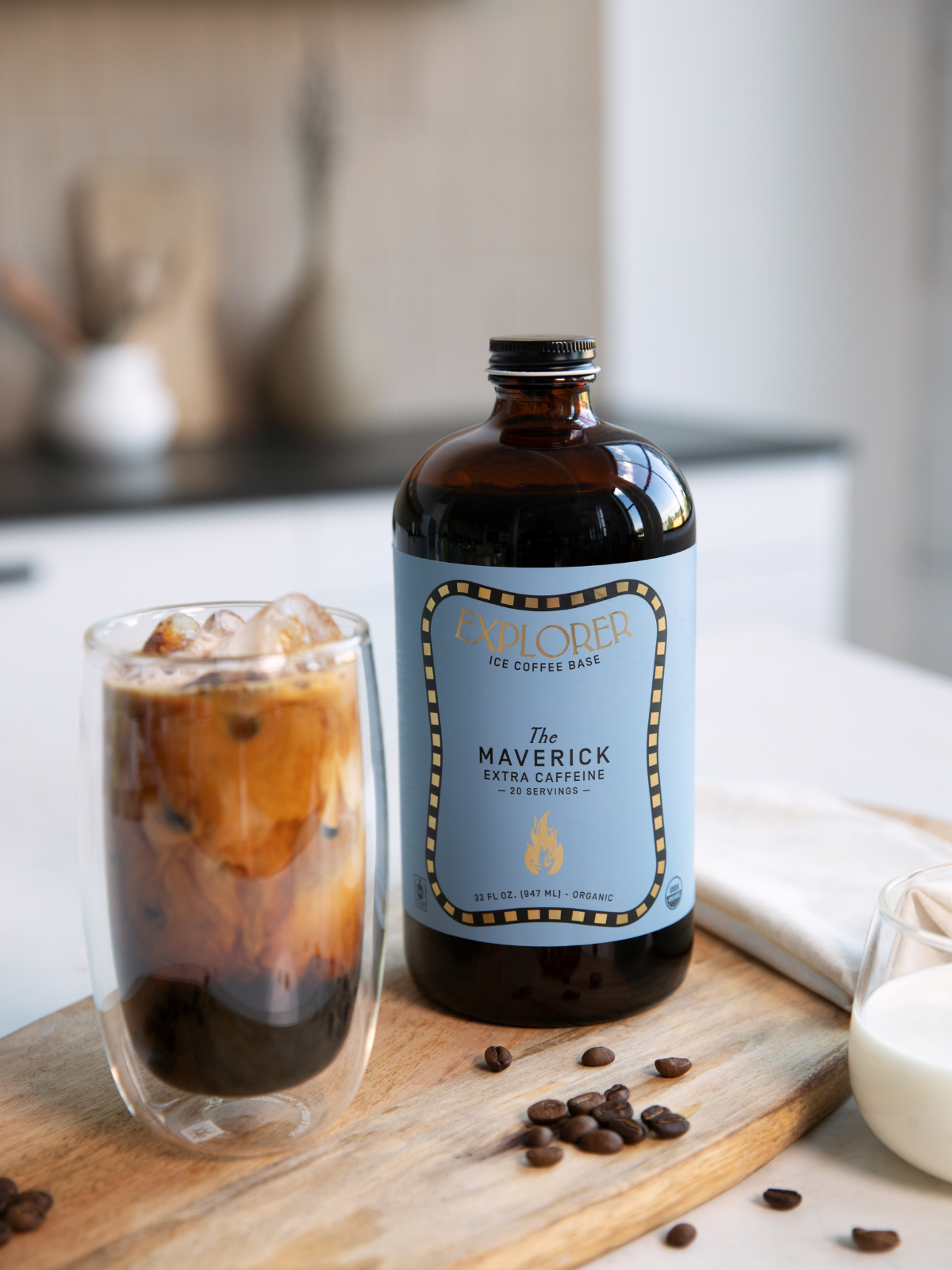 Explorer Cold Brew 32oz cold brew coffee concentrate bottle with a black cap and label, ready for brewing or blending.
