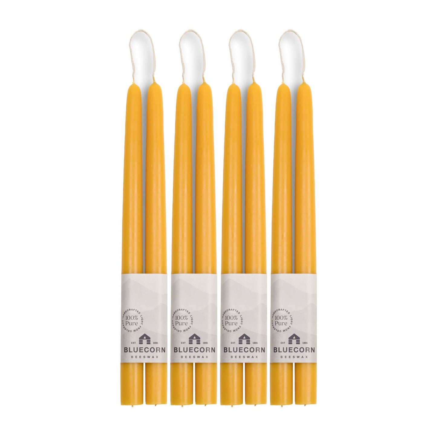 Set of 8 raw beeswax taper candles from Bluecorn Candles, 12-inch tall hand-dipped beeswax tapers for home or special occasions.