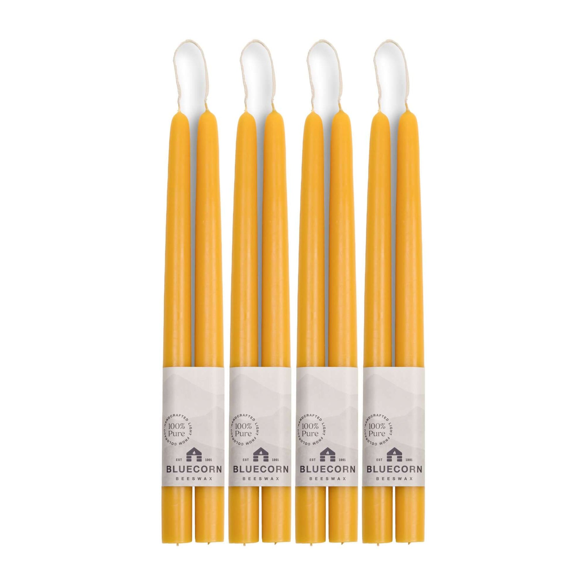 Set of 8 raw beeswax taper candles from Bluecorn Candles, 12-inch tall hand-dipped beeswax tapers for home or special occasions.