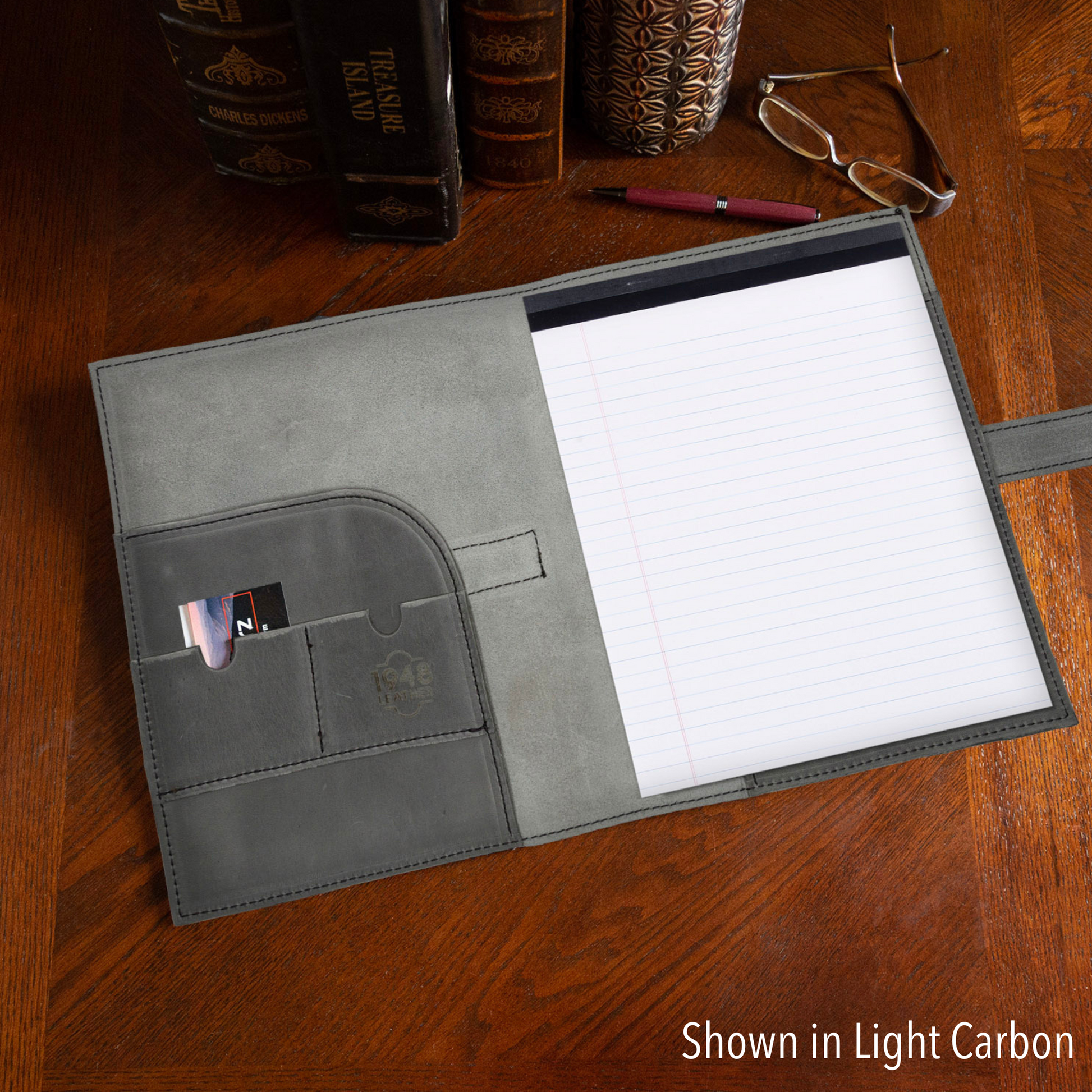 Large black journal cover by Rebekah Scott Designs featuring smooth leather texture and elegant stitching.