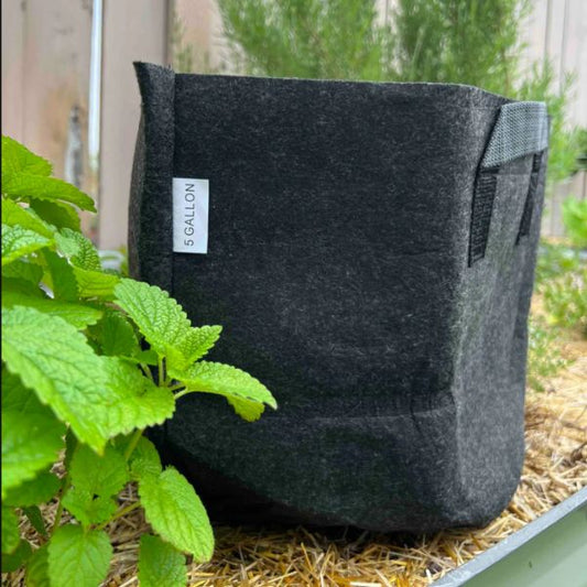 Meme's Worms Fabric Worm Bin for composting, made of breathable fabric with a lid, used for vermicomposting and organic waste recycling.