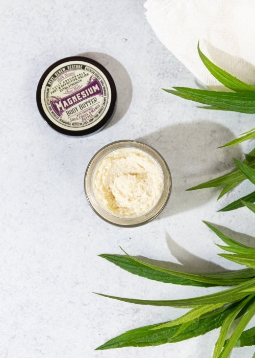 Creamy magnesium body butter by Roots and Leaves LLC, showing a jar of moisturizing body butter with natural ingredients.