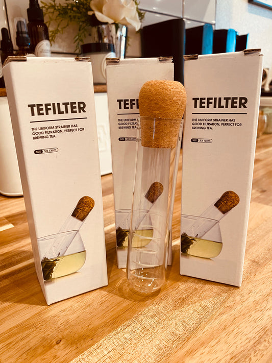 Tea test tube from TEFILTER by Onic Brands LLC, clear glass container with a metal lid for brewing or testing tea samples.