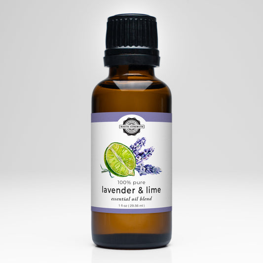 A brown glass bottle with a black cap labeled Rustic Strength Lavender & Lime Essential Oil Blend, featuring lime and lavender images—ideal for aromatherapy—displayed on a white background.