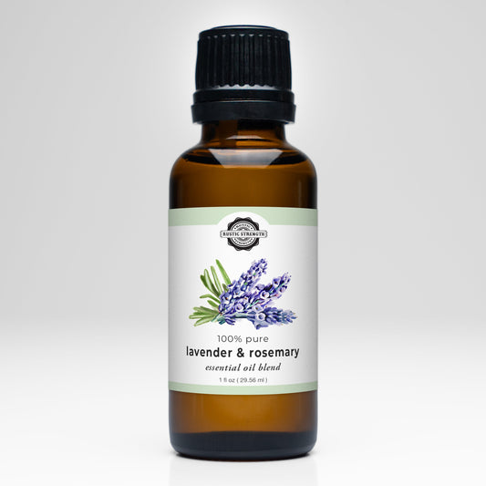 The Rustic Strength Lavender & Rosemary Essential Oil Blend comes in a brown glass bottle with a black cap and sprig illustration—ideal for aromatherapy or as a natural laundry scent enhancer.