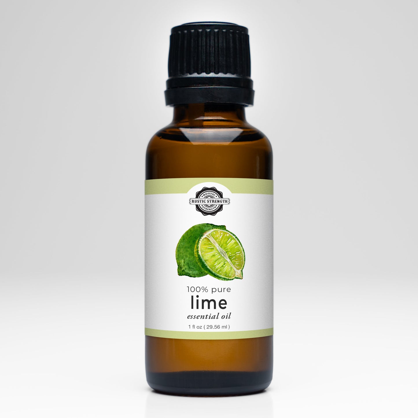 Rustic Strength Lime Essential Oil comes in a 1 fl oz (29.56 ml) brown glass bottle with a black cap, labeled 100% pure Citrus Aurantifolia. The label features a whole lime and slice, perfect for aromatherapy use.