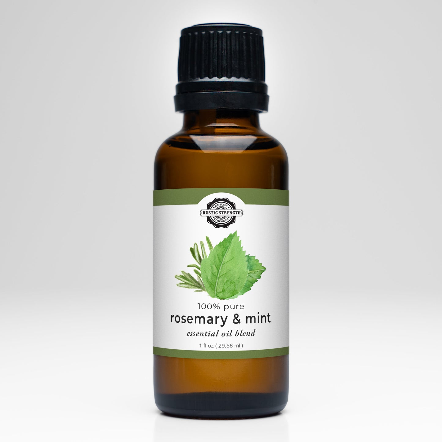 A brown glass bottle with a black cap labeled Rustic Strength Rosemary & Mint Essential Oil Blend, featuring rosemary and mint leaf illustrations. Ideal for aromatherapy or adding fresh scents to laundry.