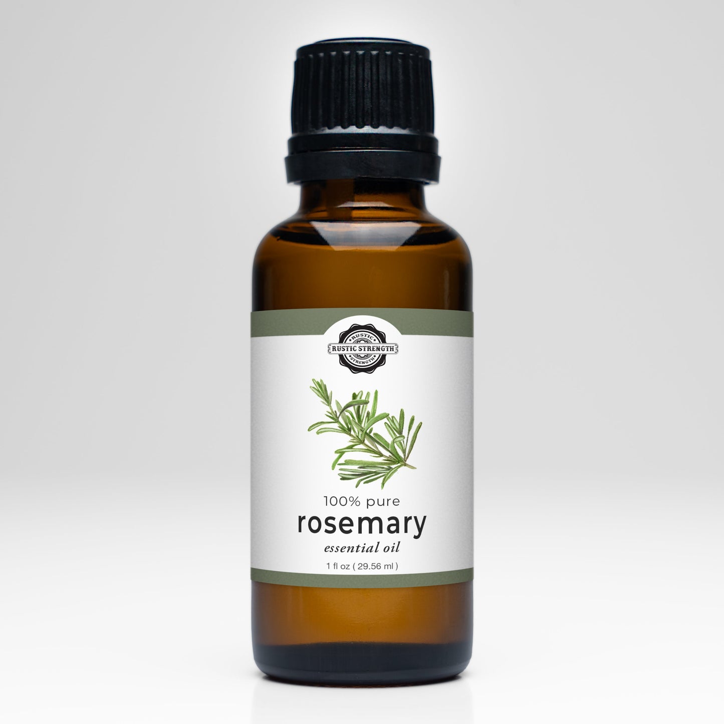Rustic Strength Rosemary Essential Oil comes in a brown glass bottle with a black cap, labeled 100% pure for aromatherapy, featuring a rosemary illustration on a white background, and contains 1 fl oz (29.56 ml).