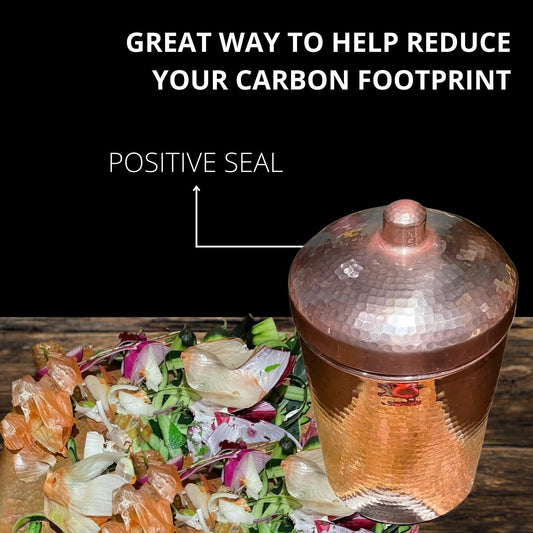 Sertodo copper kitchen compost bin canister with lid, designed for eco-friendly waste collection in a modern kitchen.