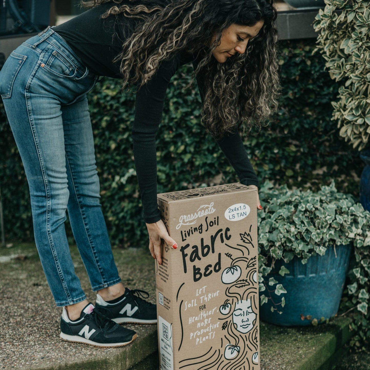 Grassroots Fabric Pot for living soil, showing breathable fabric container with healthy plant roots and gardening setup.