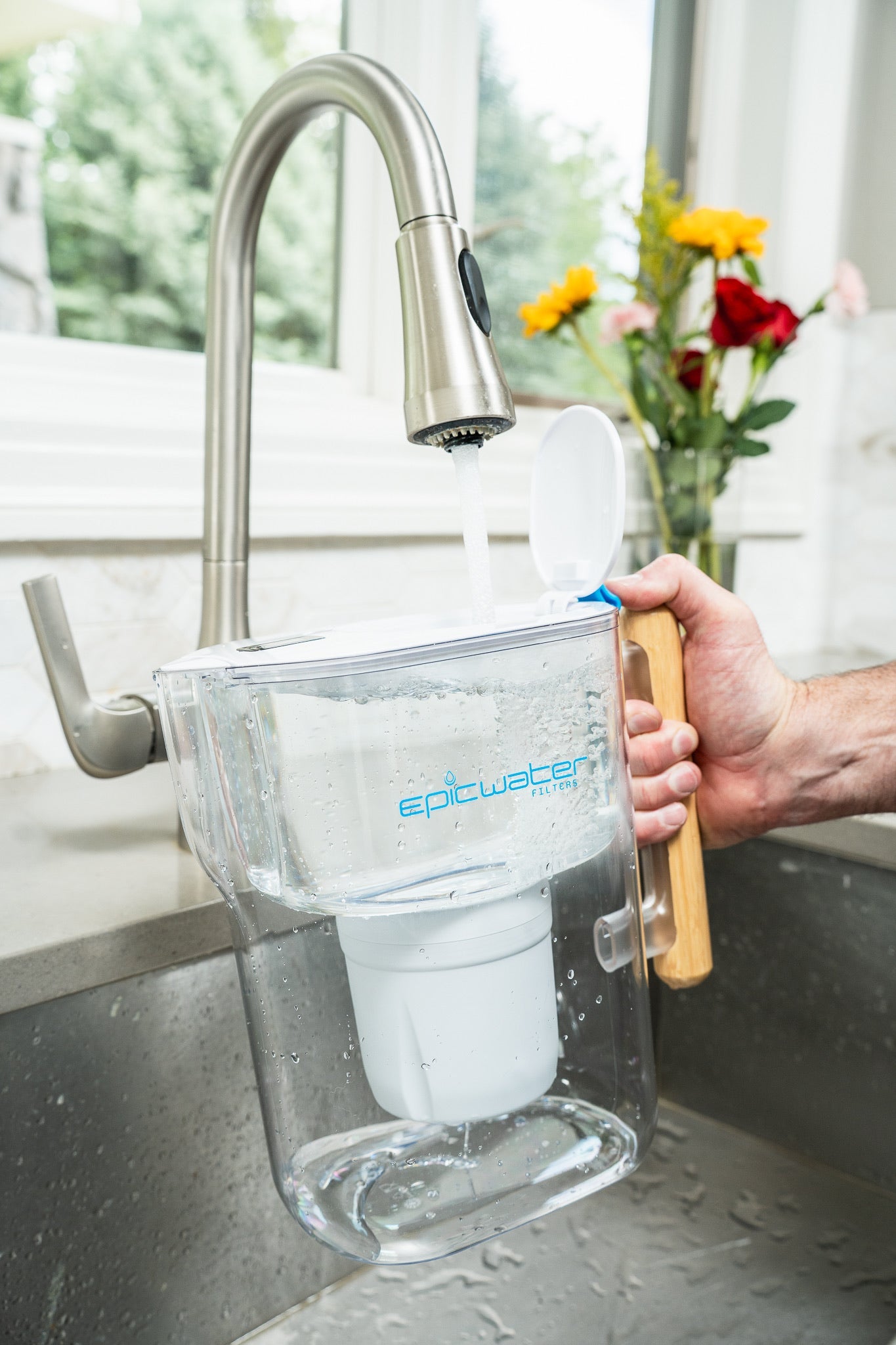 Epic Water Filters Pure XP Pitcher in red, showing the sleek design and filter cartridge for reducing fluoride, PFAS, and parasites.