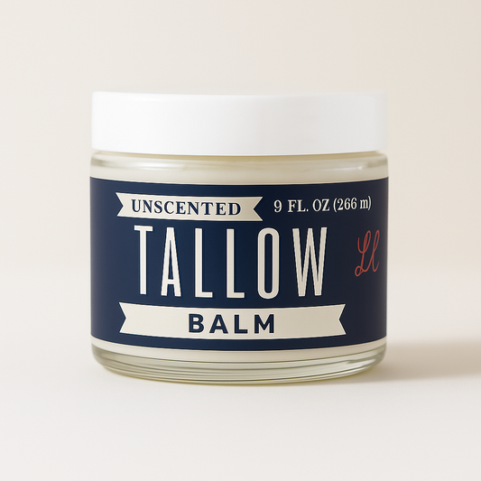 A 9 fl. oz. (266 ml) glass jar of Lady May Tallow’s Unscented Tallow Balm – All-Natural Beef Tallow Moisturizer, featuring a navy label and white lid, is displayed against a neutral background for skin nourishment.