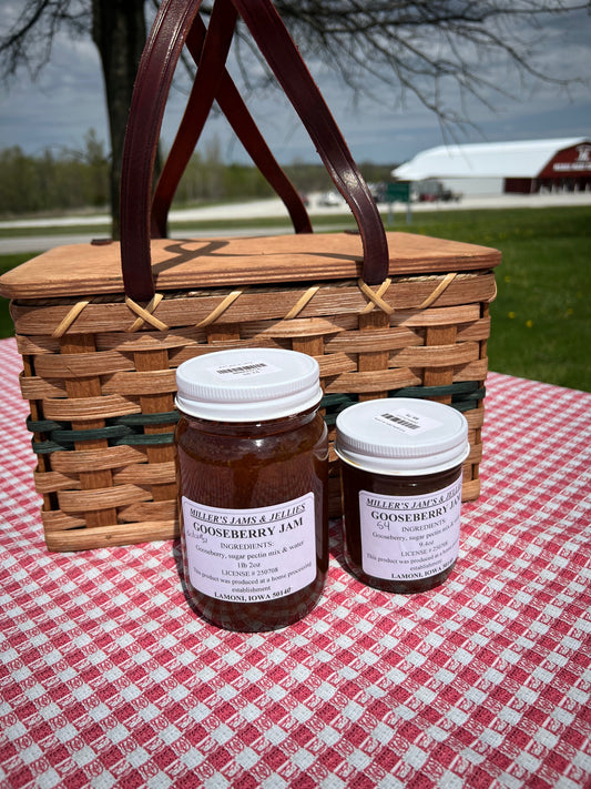 Amish Country Store Miller’s Gooseberry Jam jar showing bright green gooseberries and jam label on a rustic background.