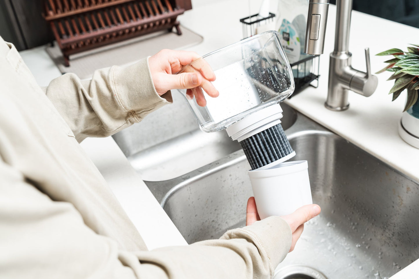 Epic Water Filters Pure XP pitcher with red lid and handle, designed to reduce fluoride, PFAS, and parasites in drinking water.