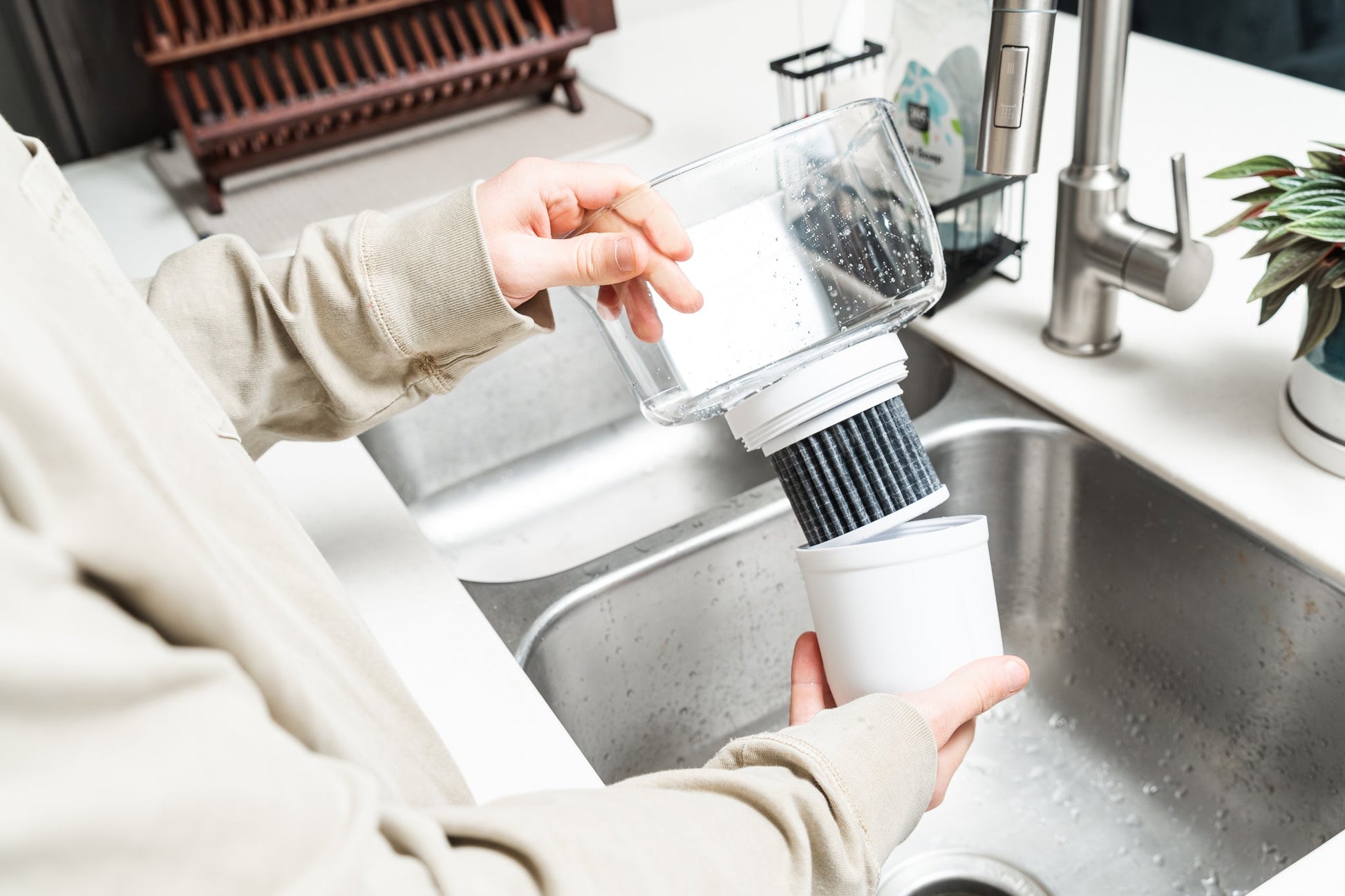 Epic Water Filters Pure XP pitcher with red lid and handle, designed to reduce fluoride, PFAS, and parasites in drinking water.
