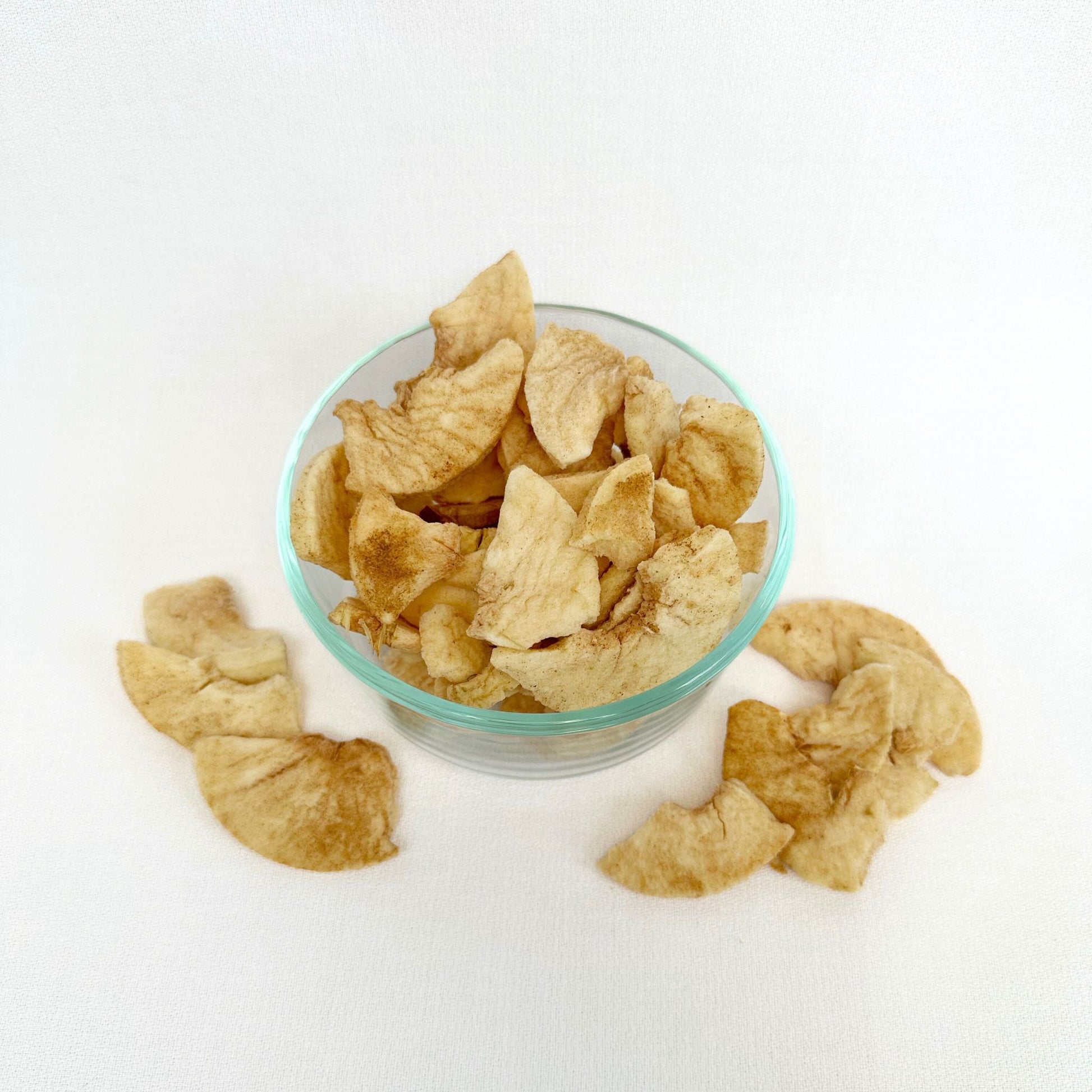 Freeze-dried cinnamon and sugar apples from Double L Ranch, showing golden apple slices coated with cinnamon and sugar.