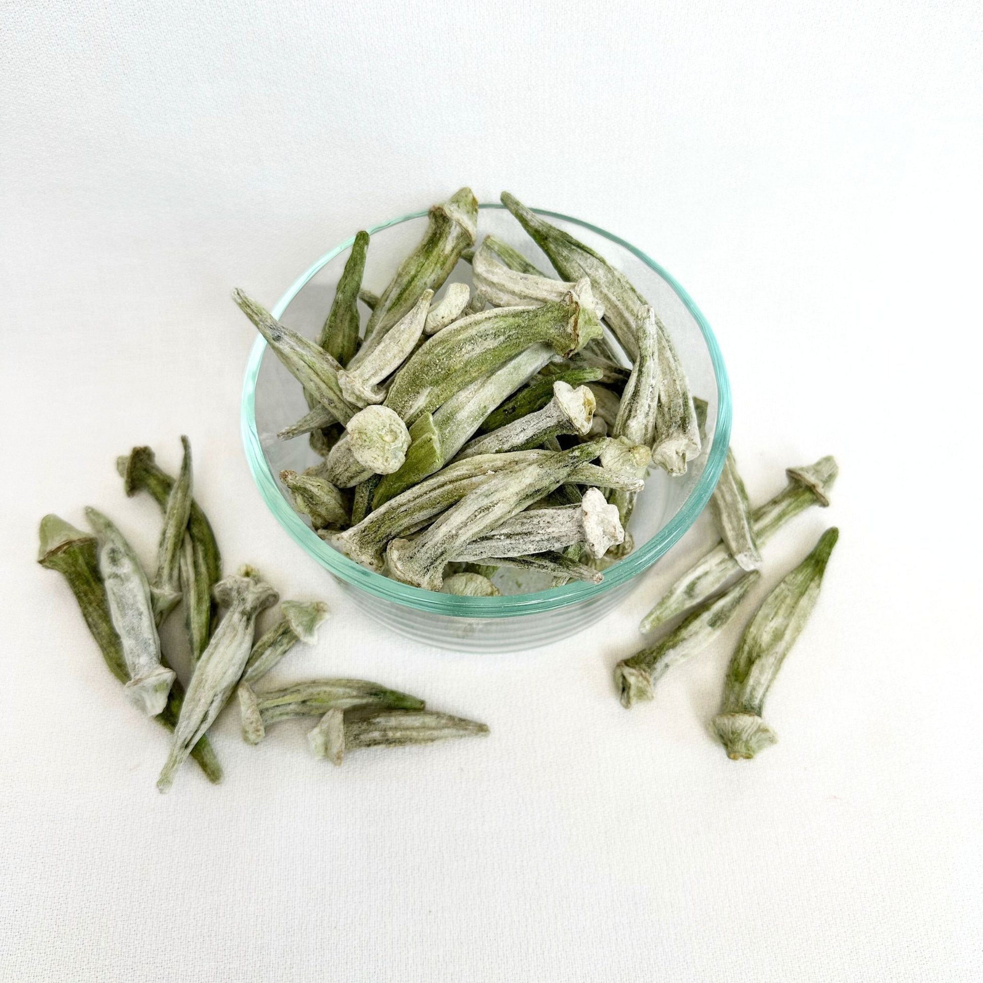 Freeze dried okra by Double L Ranch, showing vibrant green, sliced okra pieces in a clear container.