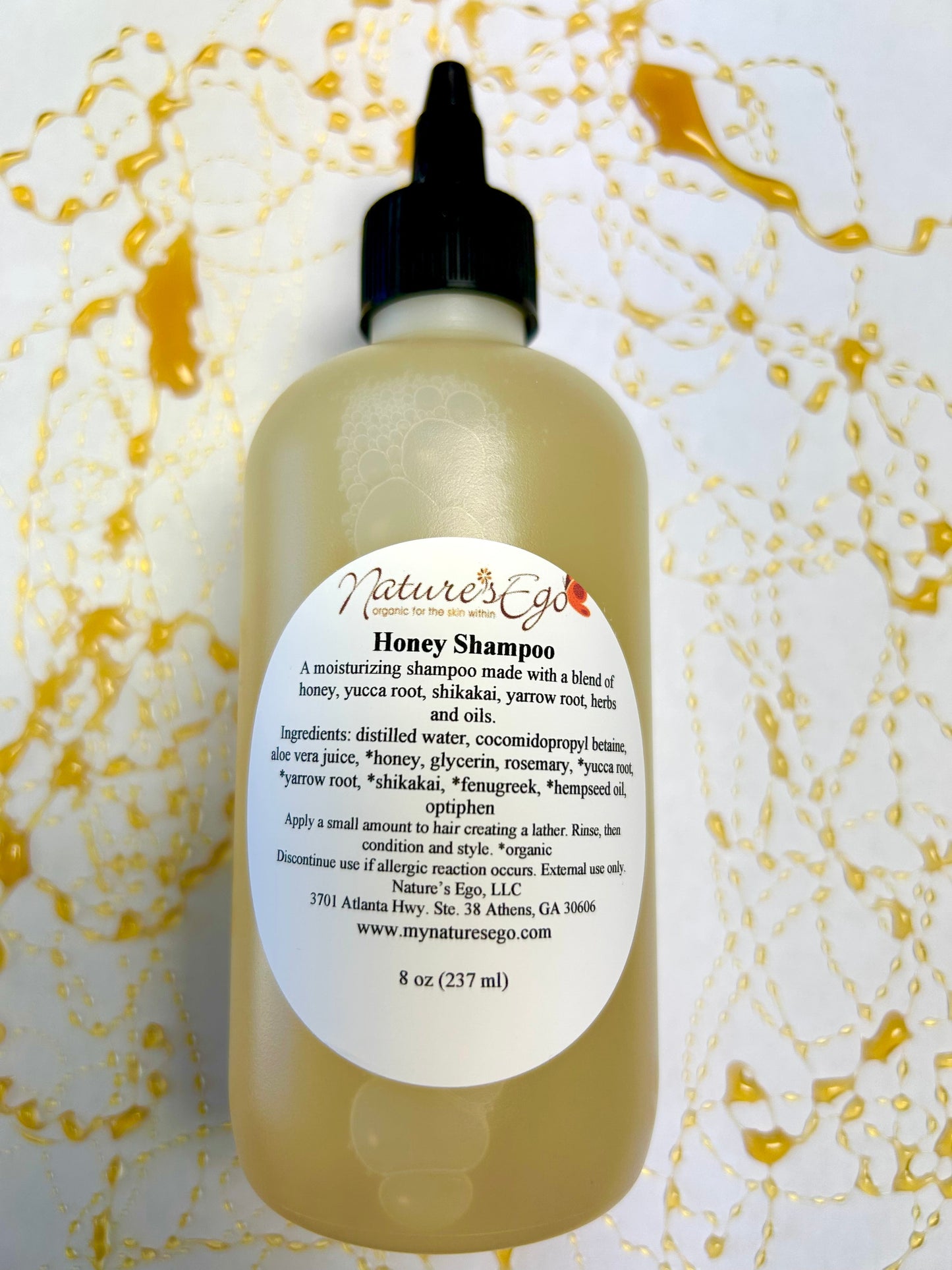 NaturesEgo Honey Shampoo with yucca root, shikakai, and yarrow root, showing a bottle of natural hair care shampoo.