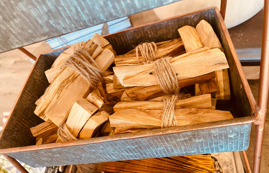 Three Palo Santo sticks in a bundle from Onic Brands LLC, natural wood incense sticks for cleansing and spiritual practices.