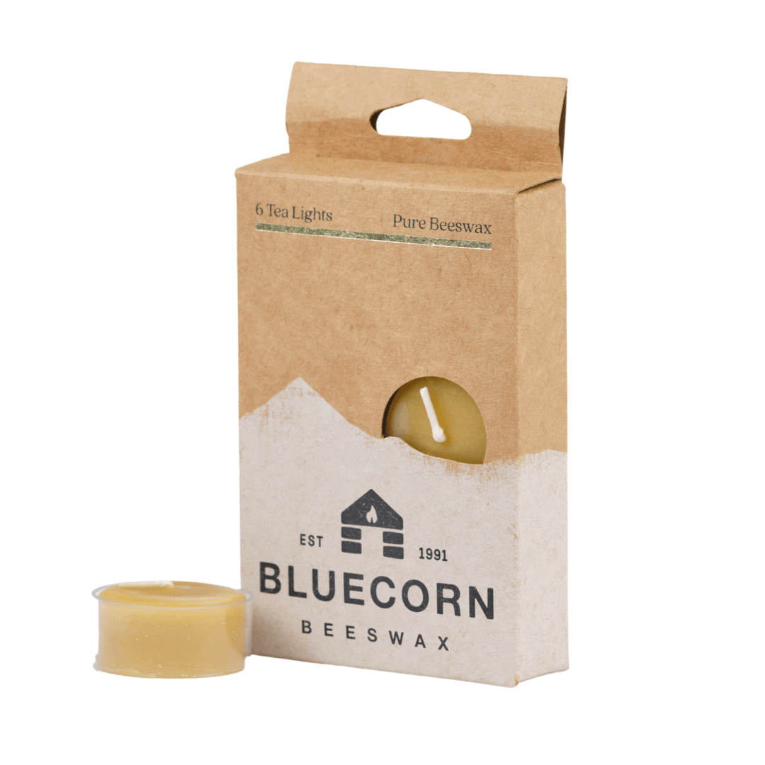 Three pure beeswax tea light candles from Bluecorn Candles, natural and unscented with warm, golden beeswax appearance.