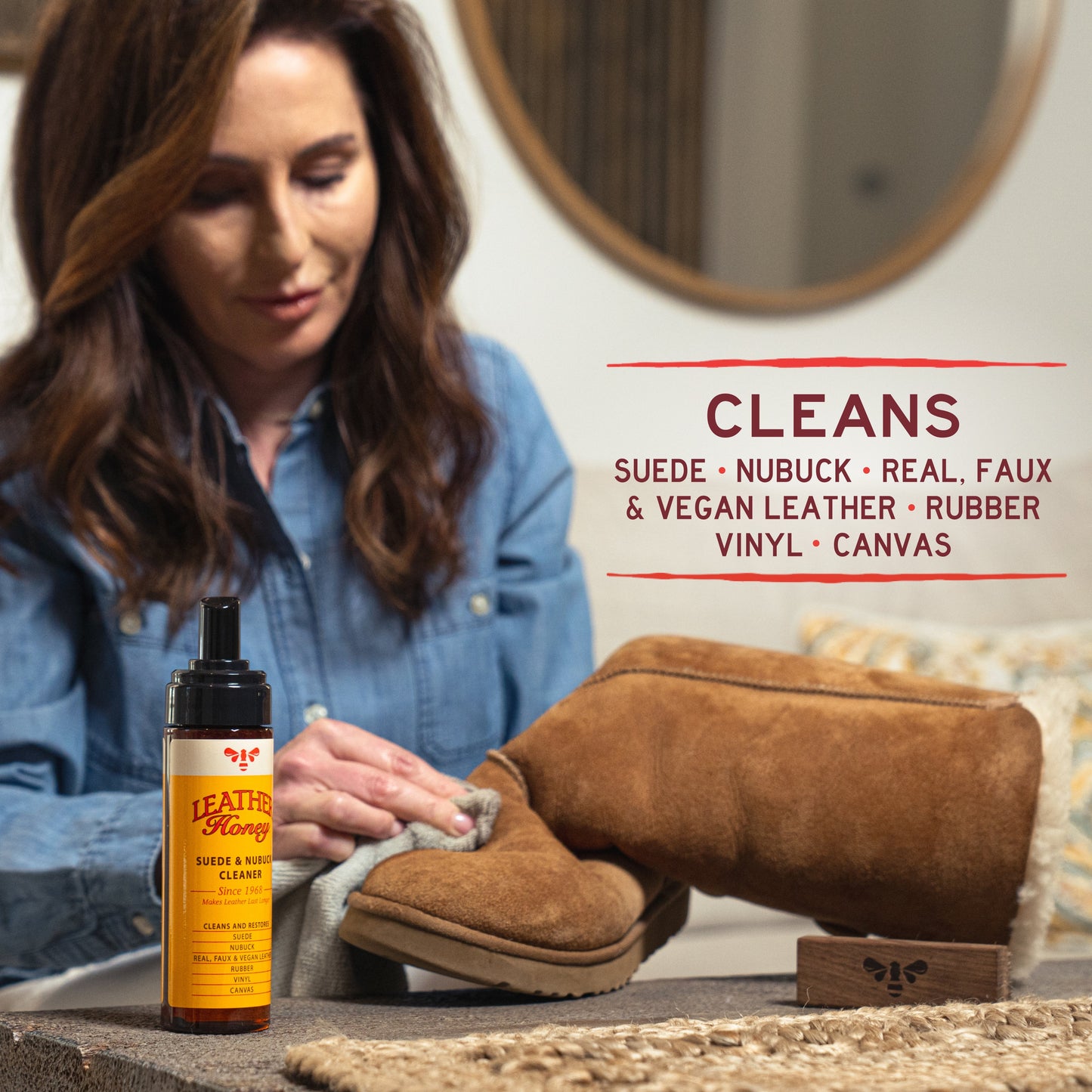 Leather Honey Suede and Nubuck Cleaner bottle for leather care, with cleaning solution and applicator brush visible in the image.