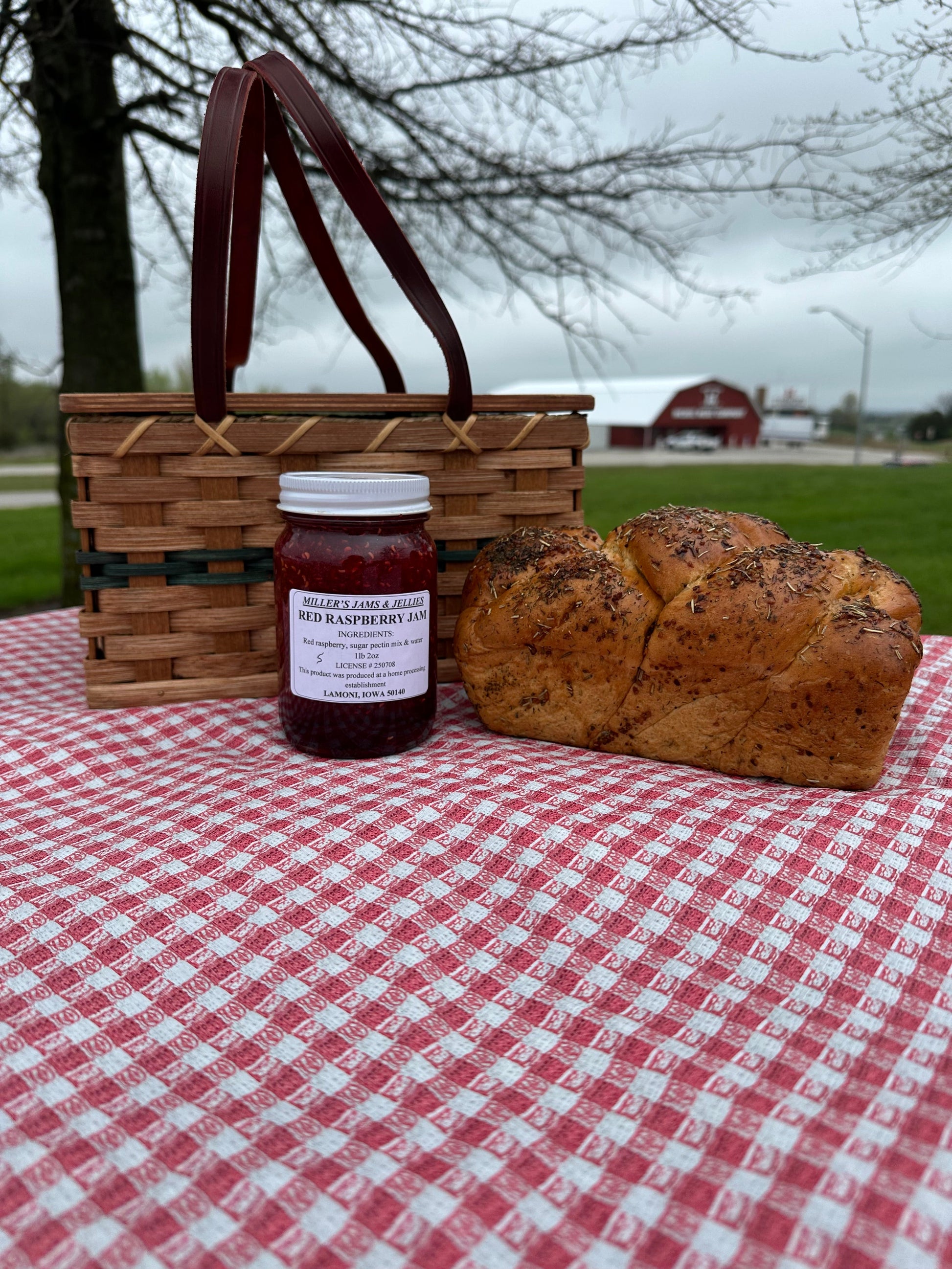 Amish Country Store Miller's red raspberry jam jar with vibrant red fruit and label, showcasing authentic Amish-made Amish jam.