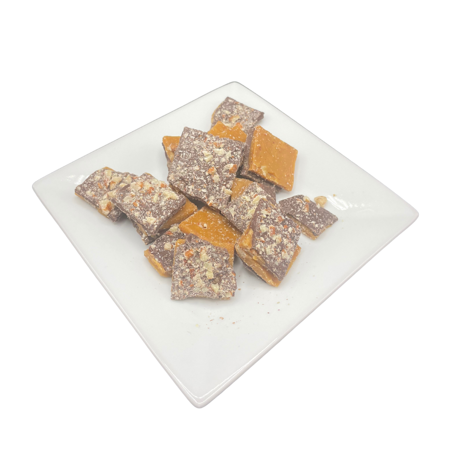 Homemade milk chocolate toffee with mixed nuts from Barb's Buttery Toffee, shown in an 8 oz package.
